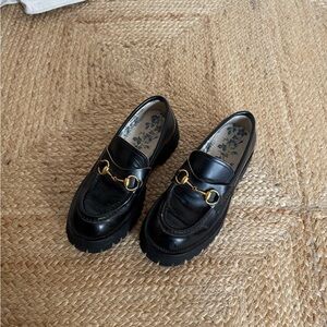 Gucci Black Leather Loafers with Gold Accents